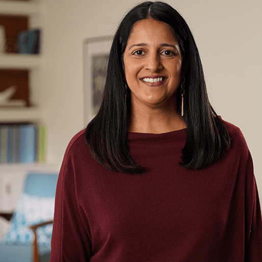 A headshot of Renee wearing smart dark clothing.